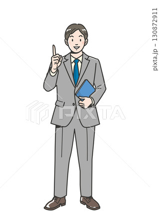 人差し指を立ててアドバイスするビジネスマンの全身 130872911