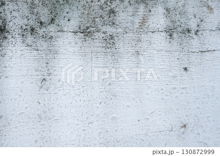 Grey cement concrete wall grunge background design. Abstract plaster textured with scratches and cracks for wallpaper or copy space Grey cement concrete wall grunge background design. Abstract plaster textured with scratches and cracks for wallpaper or copy space 130872999