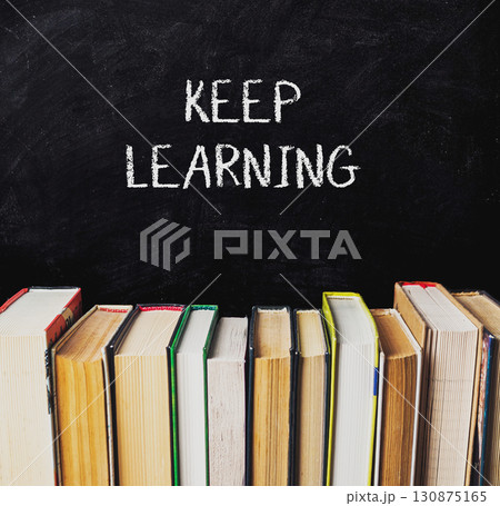 Chalkboard with the words keep learning written on it Chalkboard with the words keep learning written on it 130875165