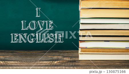 Stack of books with the words I love English written on a chalkboard Stack of books with the words I love English written on a chalkboard 130875166
