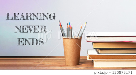 Stack of books with the words learning never ends Stack of books with the words learning never ends 130875171