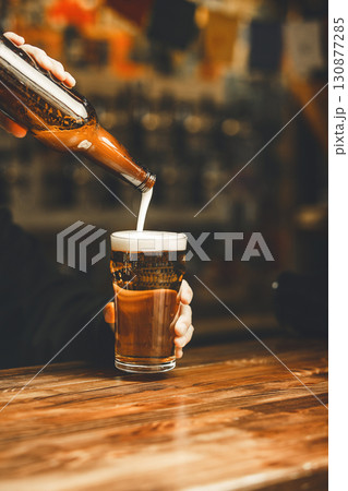 Pouring Craft Beer Into Pint Glass at Bar Pouring Craft Beer Into Pint Glass at Bar 130877285