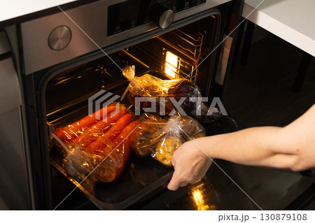 Baking Sleeve Cooking Method in an Oven With Assorted Vegetables Baking Sleeve Cooking Method in an Oven With Assorted Vegetables 130879108