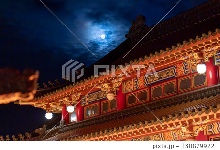 the mist cover the full moon on the top of Taiwanese temple tiles	 130879922