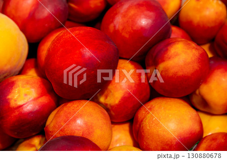 Close-up of fresh ripe nectarines as background, top view. Juicy clean fruits straight from orchard to farm store 130880678