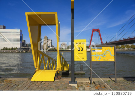 Rotterdam, the Netherlands. 06.09.2025, Water taxi in Rotterdam at the Maaskade pier with a view of the Willemsbrug bridge Rotterdam, the Netherlands. 06.09.2025, Water taxi in Rotterdam at the Maaskade pier with a view of the Willemsbrug bridge 130880719
