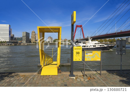 Rotterdam, the Netherlands. 06.09.2025, Water taxi in Rotterdam at the Maaskade pier with a view of the Willemsbrug bridge Rotterdam, the Netherlands. 06.09.2025, Water taxi in Rotterdam at the Maaskade pier with a view of the Willemsbrug bridge 130880721