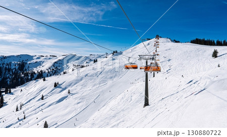 Ski Lift Ascending Snowy Mountain in Austria Winter Sports Adventure in the Austrian Alps Ski Lift Ascending Snowy Mountain in Austria Winter Sports Adventure in the Austrian Alps 130880722