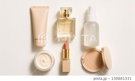 Beauty products arrangement with skincare, makeup, and fragrance on a light background 130881331