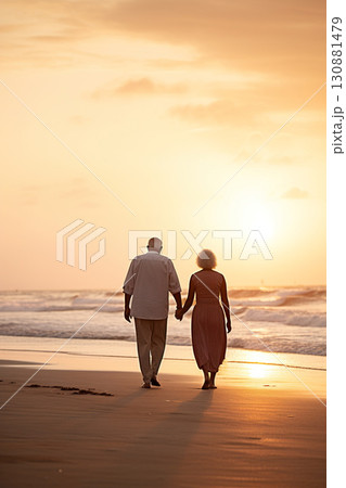 old senior couple walking by sea beach at sunset, older romantic man and woman walk by ocean shore at summer sunrise old senior couple walking by sea beach at sunset, older romantic man and woman walk by ocean shore at summer sunrise 130881479