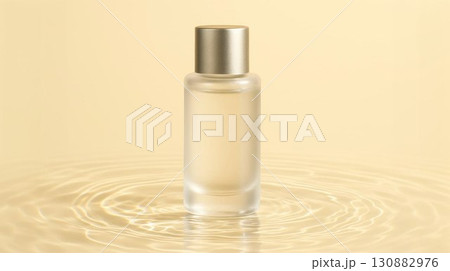 Elegant glass bottle of fragrance sits on rippling water surface, reflecting soft golden hues, creating a serene and luxurious atmosphere for beauty and personal care products 130882976