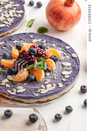 Cheesecake with tangerines and blueberries Cheesecake with tangerines and blueberries 130883916