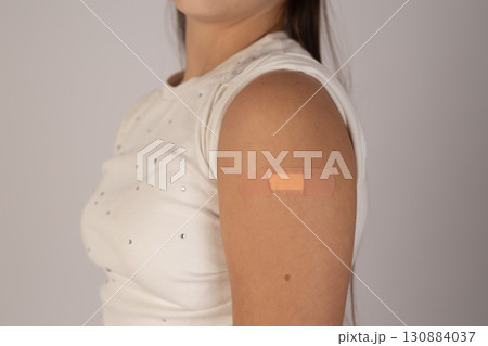 Woman with small patch on arm. Woman with small patch on arm. 130884037