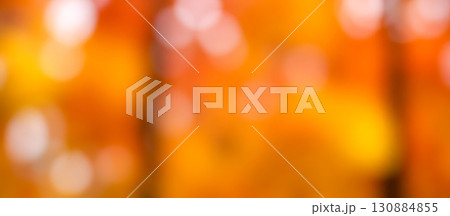 warm autumn bokeh background with golden and orange blurred lights, a beautiful abstract texture for festive holiday or seasonal concept 130884855