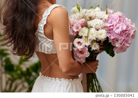 female hands holding bouquet flowers. Gift on the 8 march or valentines day. pink hydrangea female hands holding bouquet flowers. Gift on the 8 march or valentines day. pink hydrangea 130885041