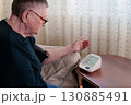 Distressed woman confronts high blood pressure readings, emphasizing the gravity of the situation and the importance of promptly addressing the cardiovascular health concern 130885491