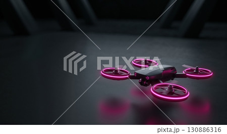 A sleek matte black drone with vibrant neon pink propeller lights hovers in a dark, reflective, futuristic indoor environment with copy space. 130886316