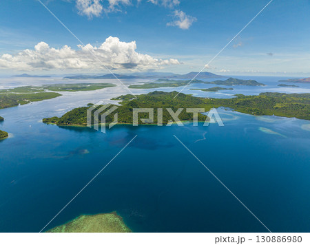 Tropical islands surrounded by blue water and sky landscape, travel concept. Mindanao, Philippines. 130886980