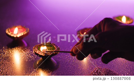 Celebrating Diwali with bright traditional candles 130887008