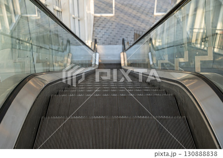 Empty escalator in modern building 130888838
