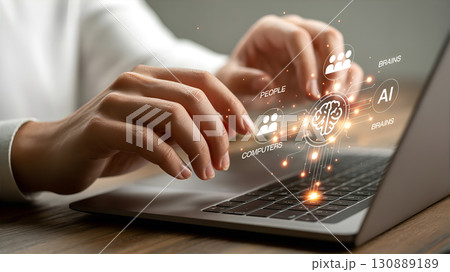 A person is working at a laptop with virtual icons symbolizing technology. A person is working at a laptop with virtual icons symbolizing technology. 130889189