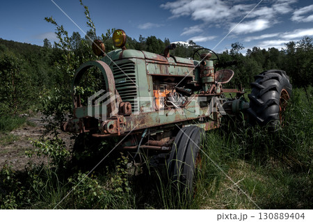 Rusty Vintage Tractor In Rural Landscape Of Lofoten Islands In Norway 130889404