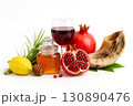 Jewish New Year, known as Rosh Hashanah, is commemorated through sacred traditions symbols including apples, honey, pomegranates, shofar. 130890476