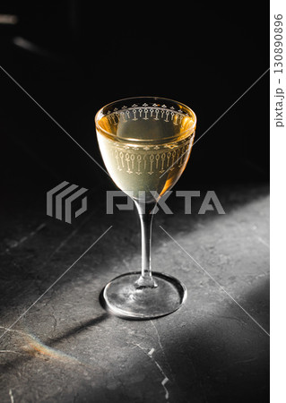 Golden cocktail in elegant etched glass Golden cocktail in elegant etched glass 130890896