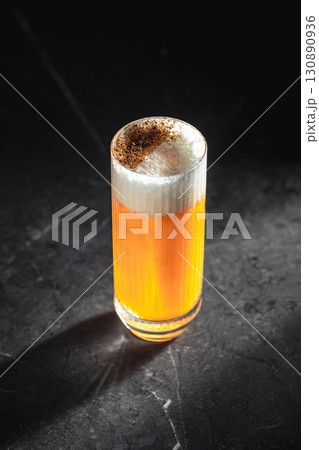 Highball sour cocktail with foam and spices 130890936