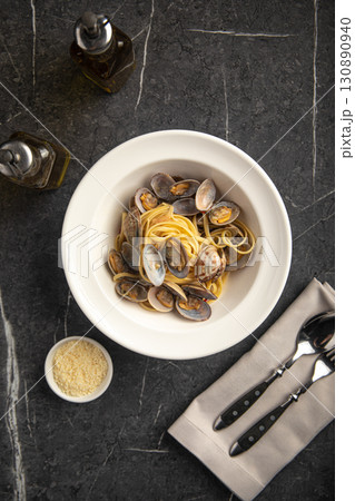 Italian pasta with clams and seafood in bowl Italian pasta with clams and seafood in bowl 130890940