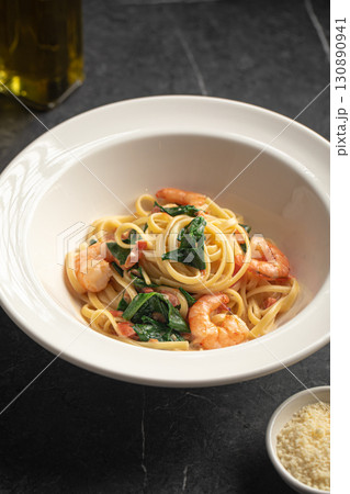 Creamy pasta with shrimp and spinach Creamy pasta with shrimp and spinach 130890941
