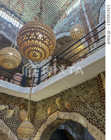 Explore traditional pottery at the Guellala shop in Djerba, Tunisia amid stunning desert scenery 130891421