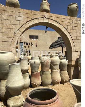 Explore traditional pottery at the Guellala shop in Djerba, Tunisia amid stunning desert scenery 130891462