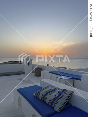Sunset view from the rooftop of a white house overlooking the sea in Djerba, Tunisia 130891478