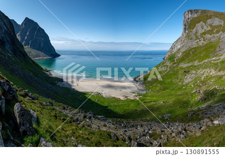 Kvalvika Sand Beach With Mountains And Ocean On Lofoten Islands In Norway Kvalvika Sand Beach With Mountains And Ocean On Lofoten Islands In Norway 130891555
