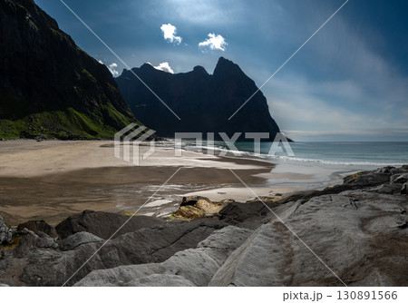 Kvalvika Sand Beach With Mountains And Ocean On Lofoten Islands In Norway Kvalvika Sand Beach With Mountains And Ocean On Lofoten Islands In Norway 130891566