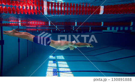Streamlined swimmer underwater training in competitive pool Streamlined swimmer underwater training in competitive pool 130891888