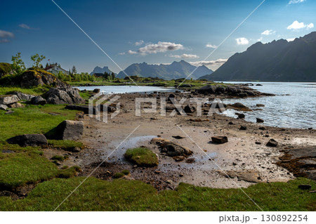 Coastal Landscape With Fjord And Cottage Near Leknes On Lofoten Islands In Norway Coastal Landscape With Fjord And Cottage Near Leknes On Lofoten Islands In Norway 130892254