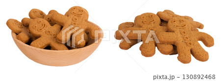 Gingerbread man in wooden bowl isolated on white background Gingerbread man in wooden bowl isolated on white background 130892468