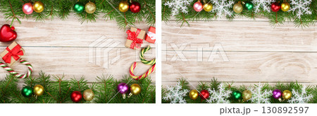 Christmas frame made of fir branches decorated with balls, candy canes and boxes on a light wooden background 130892597
