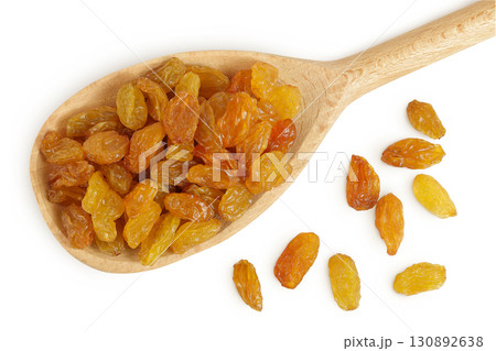 Yellow Raisins in wooden spoon isolated on white background. Top view. Flat lay, 130892638