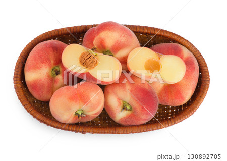 chinese flat donut peaches in a wicker basket isolated on white background. Top view. Flat lay chinese flat donut peaches in a wicker basket isolated on white background. Top view. Flat lay 130892705