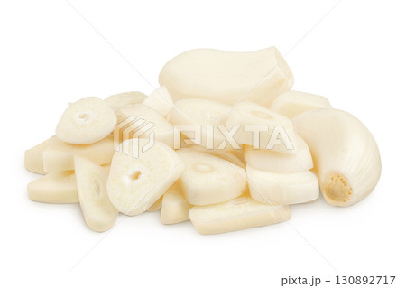 garlic cloves slices isolated on white background close up garlic cloves slices isolated on white background close up 130892717