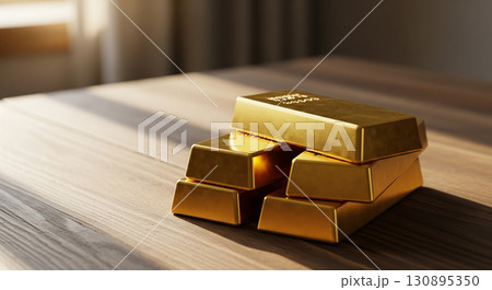 Golden Bullion Stacked on Wooden Surface in Sunlight 130895350