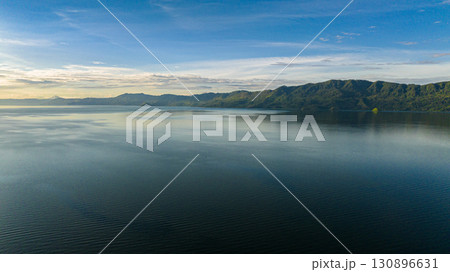 Aerial view of lake Toba in Sumatra among the mountains. Sumatra, Indonesia. Aerial view of lake Toba in Sumatra among the mountains. Sumatra, Indonesia. 130896631