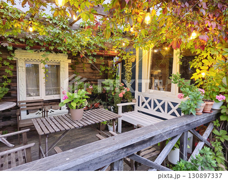 Inviting leafy patio dining space Inviting leafy patio dining space 130897337