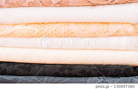 Close up of lace textures in layers, pastel colors Close up of lace textures in layers, pastel colors 130897360