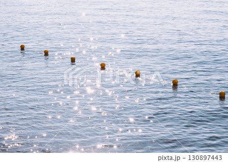 Sun shining in calm rippling Mediterranean Sea water 130897443