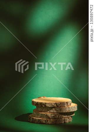 wooden stand against a green background wooden stand against a green background 130897472