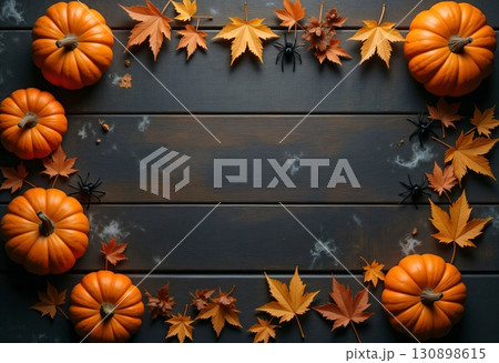 Dark wooden background with bright pumpkins and leaves Dark wooden background with bright pumpkins and leaves 130898615